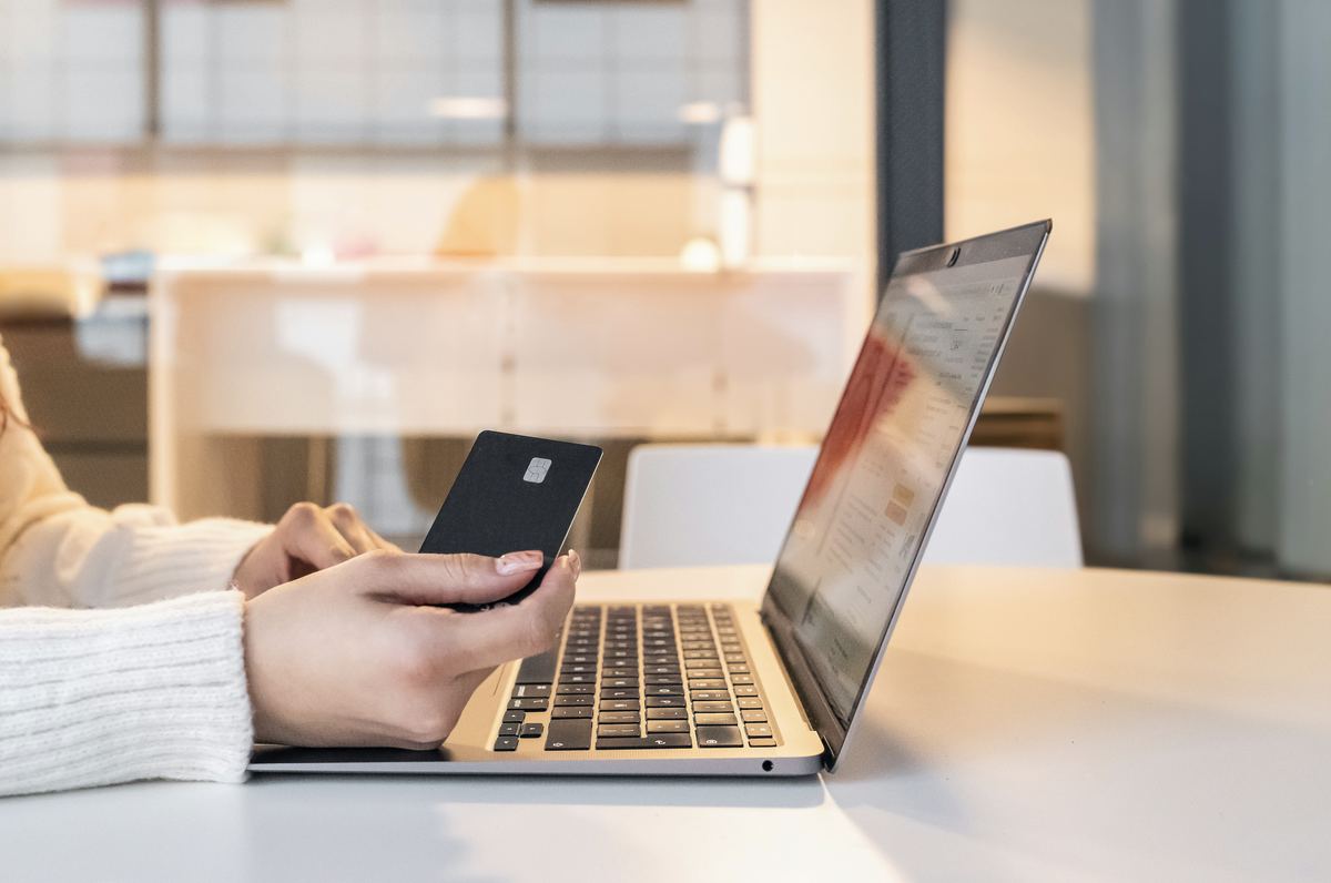 Applying for a credit card online with card in hand